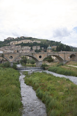 Cosenza, Italy - June 13, 2018 : View of Alarico bridge in Cosenza and the old town on the background