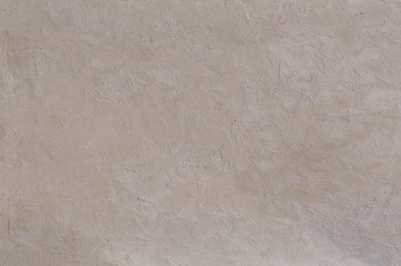 Close-up surface detail of old rough white plaster wall texture, macro.