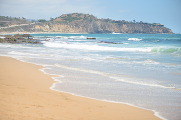 Beautiful sandy beach and waves in the ocean