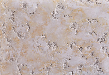 Close-up surface detail of old rough white plaster wall texture, macro.