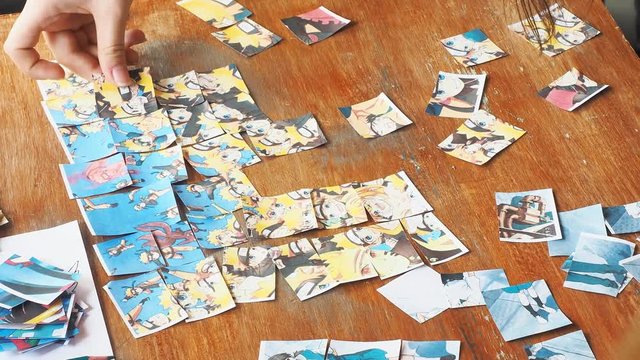 people collect puzzles on the table