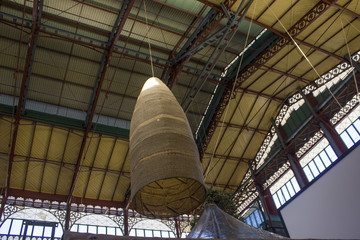 Mercato Centrale in Florence, looking up at the rooftop with pening lamps