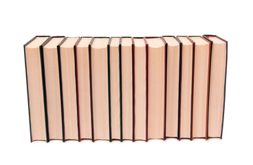 Stack of old paper books on a white background