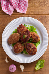 Delicious homemade burgers or cutlets. overhead, vertical