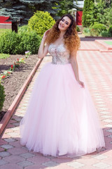Fototapeta premium Girl in pink wedding dress