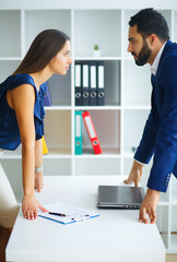 Business. Office Business Woman and Business Man Leading Talks at the Light Office Sitting at the...