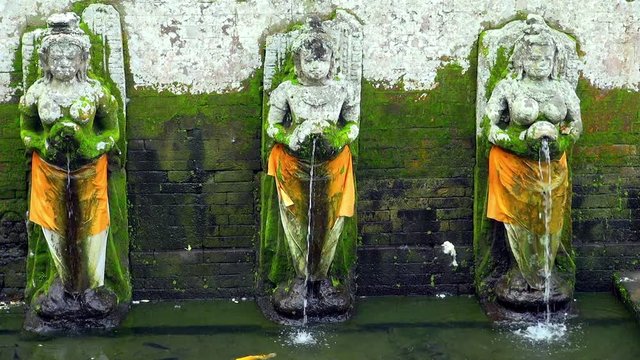 Statues Pouring Water To Pond In Goa Gajah, Bali