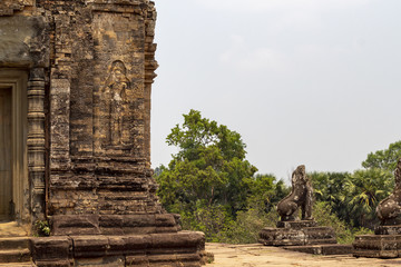 Fototapeta premium Ancient temple stone carving in Angkor Wat. Pre Rup temple view from upper level. Buddhist or hindu temple.