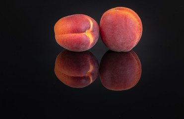 Two Apricots On A Black Background 2