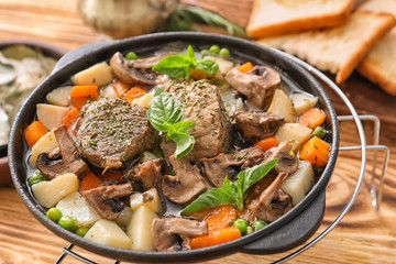 Pan with stewed meat and potatoes, closeup