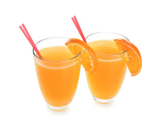 Glasses with fresh citrus juice on white background