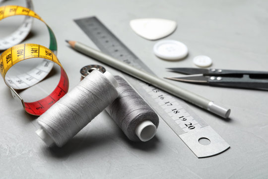 Composition with accessories for tailoring on table, closeup