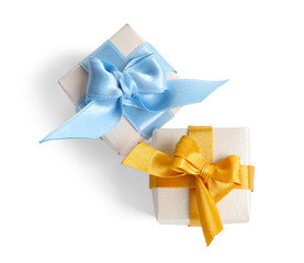 Beautifully wrapped gift boxes on white background, top view