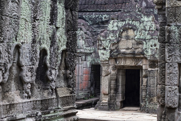 Fototapeta na wymiar Ancient temple in Angkor Wat. Preah Khan temple mossy stone bas-relief ornament. Buddhist or hindu temple.