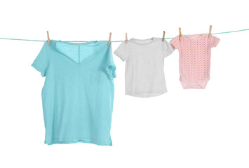 Clothes on laundry line against white background