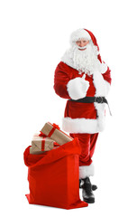 Authentic Santa Claus with red bag full of gifts on white background