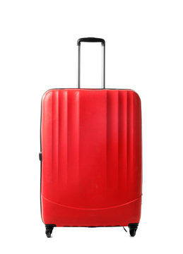 Bright red suitcase packed for journey on white background