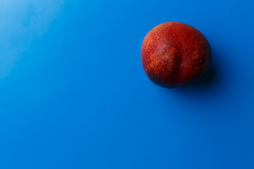 nectarine on blue background