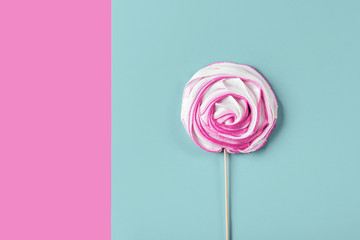 Pink candy on blue pastel background