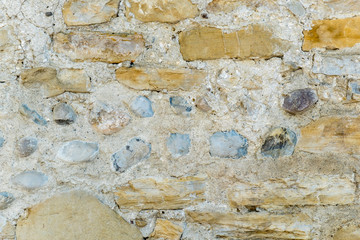 Old brown stones from an old stone wall