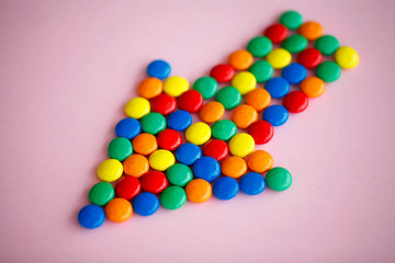 Pointer on the Pink Background. Colored Candy. Diet. Healthful Nutrition. High Resolution
