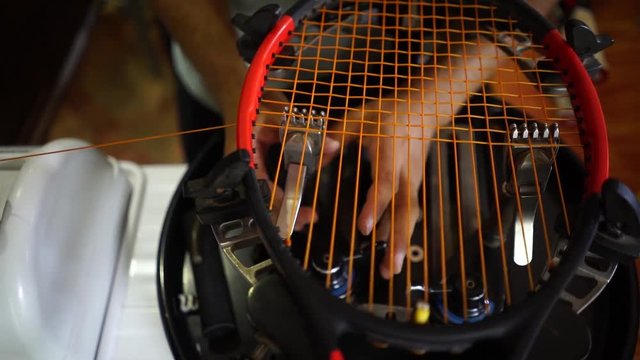 Stringing a tennis racket in slow motion