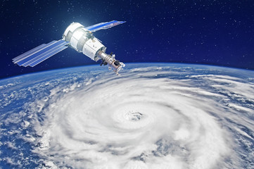 Research, probing, monitoring of tracking in a tropical storm zone, a hurricane. Satellite above the Earth makes measurements of the weather parameters. Elements of this image furnished by NASA. © aapsky