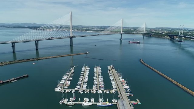 4K aerial footage of the Queensferry Crossing bridge across the Firth of Forth near Edinburgh.