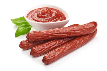 Smoked sausages with fresh herbs, isolated on white background.