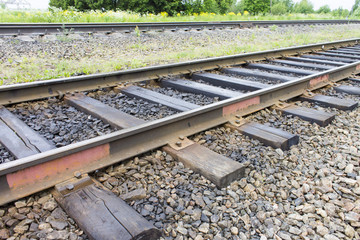 Railroad with old sleepers. Industrial concept background. Railroad travel, railway tourism.