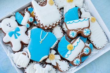 Candy bar on baby's christening party: various gingerbreads with blue mastic for little boy