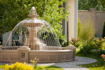 Large round cascading concrete fountain