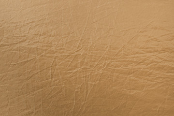 Fototapeta na wymiar Crumpled beige texture for background