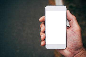 Hand with smartphone mock up copy space
