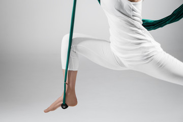 Different inversion aerial yoga with a hammock