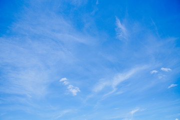 Naklejka na ściany i meble Blue sky with fluffy white clouds.
