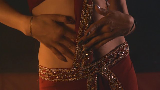 Belly dancer slow motion, warm oriental mood with smoke
