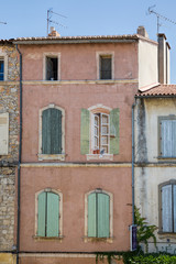 Fototapeta na wymiar Arles house with green shutters, Provence, France