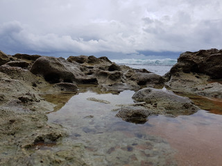 Stone coast of the Indian Ocean before the storm. The coast of Sri Lanka