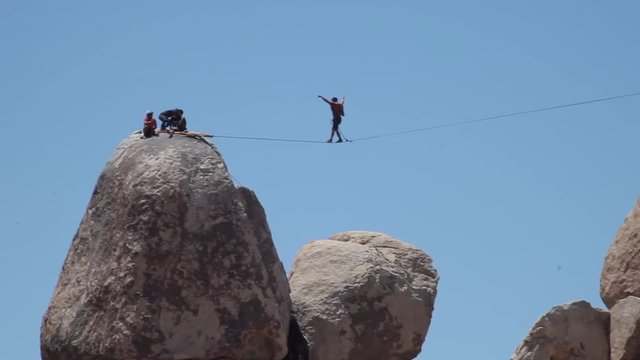 Walking on the slackline at Horror Rocks Joshua Tree National Park