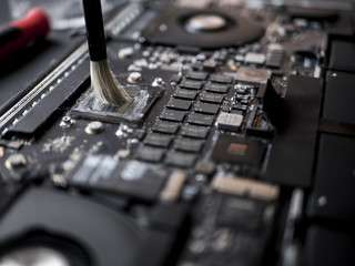 close up macro brush working cleaning the broken laptop
