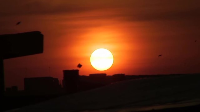 Time Lapse: Kites Flying While Sun Sets