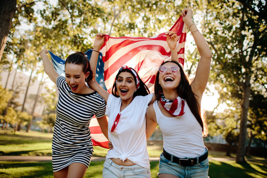 Enthusiastic American girls celebrating independence day - Powered by Adobe