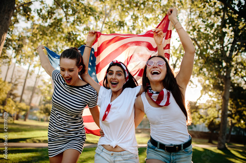 Enthusiastic American girls celebrating independence day