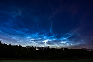 Naklejka na ściany i meble Atmospheric phenomenon of noctilucent clouds (night shining clouds), June 25, 2018, Central Russia