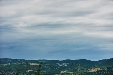 Mountain forest landscape covered by green pine under morning sky with clouds, Country Side