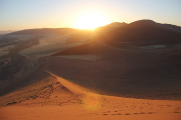 Fototapeta na wymiar Sand dunes at sunrise in Namibia desert