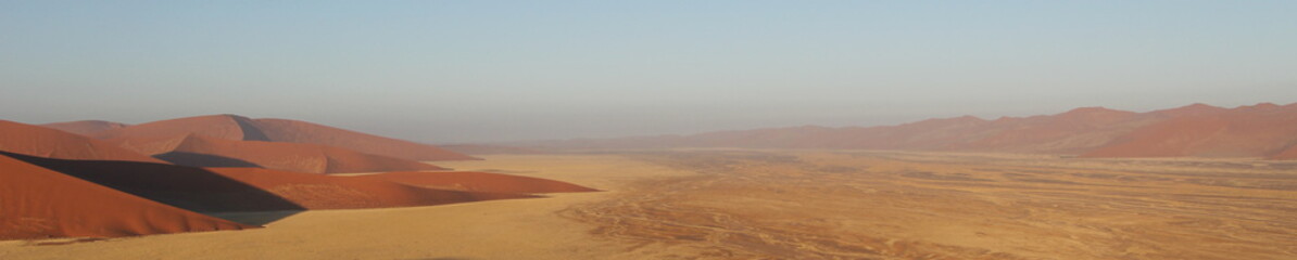 Panorama of sand dunes at sunrise in Namibia 