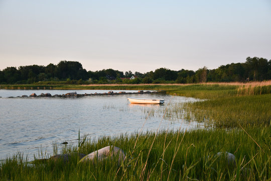 Coastal view with a lone rowing boat