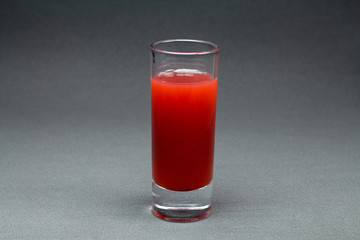 Glass of red liquid